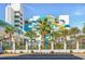 Street view of a waterpark resort with slides, palm trees, and pedestrian bridge at 1501 S Ocean Blvd. # 639, Myrtle Beach, SC 29577