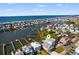 Picturesque aerial view of coastal houses with docks, waterways, and ocean views, offering serene waterfront living at 1510 North Shore Dr, Sunset Beach, NC 28468