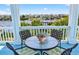 Relaxing balcony featuring outdoor seating and serene waterfront views of neighborhood homes at 1510 North Shore Dr, Sunset Beach, NC 28468