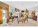 Spacious bedroom with a sitting area, desk, and bright windows with custom draperies at 1510 North Shore Dr, Sunset Beach, NC 28468