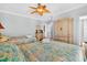 Comfortable bedroom with two beds, dresser, and neutral walls at 1510 North Shore Dr, Sunset Beach, NC 28468