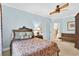 Inviting bedroom with a decorative bed, soft lighting, and access to the hallway at 1510 North Shore Dr, Sunset Beach, NC 28468