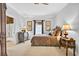 Comfortable bedroom with bedside tables, soft lighting, and an ensuite bathroom at 1510 North Shore Dr, Sunset Beach, NC 28468
