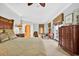 Bright primary bedroom featuring a sitting area, large windows and neutral decor at 1510 North Shore Dr, Sunset Beach, NC 28468