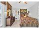 Comfortable bedroom featuring a bed, dresser, tropical decor and doorway to bathroom creating a relaxing and inviting space at 1510 North Shore Dr, Sunset Beach, NC 28468