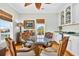 Elegant dining area featuring a glass table, wicker chairs and built in bar with marble countertop at 1510 North Shore Dr, Sunset Beach, NC 28468