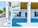 Charming exterior with spiral staircase leading to balcony at 1510 North Shore Dr, Sunset Beach, NC 28468