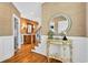 Elegant foyer featuring hardwood floors, decorative wainscoting, and ornate furnishings at 1510 North Shore Dr, Sunset Beach, NC 28468