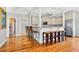 Spacious kitchen with counter seating, stainless appliances, and custom cabinetry at 1510 North Shore Dr, Sunset Beach, NC 28468