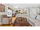 Spacious living room featuring stylish seating, wood floors, and view of the dining area at 1510 North Shore Dr, Sunset Beach, NC 28468