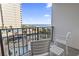 Balcony view of the pool area and ocean beyond at 1605 S Ocean Blvd. # 208, Myrtle Beach, SC 29577