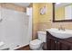 Cozy bathroom features wood-style tile and walk-in shower at 1605 S Ocean Blvd. # 208, Myrtle Beach, SC 29577