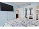 Updated bedroom with flatscreen TV and access to kitchen at 1605 S Ocean Blvd. # 208, Myrtle Beach, SC 29577