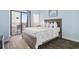 Comfortable bedroom with balcony access and ocean view at 1605 S Ocean Blvd. # 208, Myrtle Beach, SC 29577