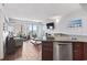 Spacious living room and kitchen showcasing wood tile flooring, an ocean view, and comfortable seating options at 1605 S Ocean Blvd. # 208, Myrtle Beach, SC 29577
