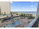 Upper floor balcony view overlooking the pool and spa at 1605 S Ocean Blvd. # 208, Myrtle Beach, SC 29577
