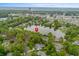 Stunning aerial view of a community with a lake and a red pin marking the location at 1809 Crooked Pine Dr. # G3, Surfside Beach, SC 29575
