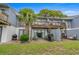 Spacious backyard with patio, grill, and a large palm tree, perfect for outdoor entertaining at 1809 Crooked Pine Dr. # G3, Surfside Beach, SC 29575