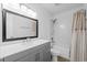 Bright bathroom boasts a vanity, framed mirror, and a shower-tub combination at 1809 Crooked Pine Dr. # G3, Surfside Beach, SC 29575