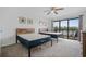 Bright bedroom with beds, ceiling fan, and a sliding glass door to the outdoor area at 1809 Crooked Pine Dr. # G3, Surfside Beach, SC 29575
