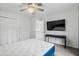This bedroom features a ceiling fan, large closet, television, and desk at 1809 Crooked Pine Dr. # G3, Surfside Beach, SC 29575