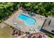 Aerial view of the community pool with lounge chairs and tables for relaxing at 1809 Crooked Pine Dr. # G3, Surfside Beach, SC 29575