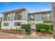 Charming two-story townhouse with a well-maintained and inviting front yard at 1809 Crooked Pine Dr. # G3, Surfside Beach, SC 29575