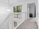 Upstairs hallway with a large window providing a view of the scenery at 1809 Crooked Pine Dr. # G3, Surfside Beach, SC 29575
