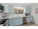 Updated kitchen features stainless steel appliances, stylish tile backsplash, and custom cabinetry at 1809 Crooked Pine Dr. # G3, Surfside Beach, SC 29575