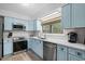 Updated kitchen features stainless steel appliances, stylish tile backsplash, and custom cabinetry at 1809 Crooked Pine Dr. # G3, Surfside Beach, SC 29575