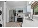 Kitchen with stainless steel appliances, custom cabinetry and tile flooring at 1809 Crooked Pine Dr. # G3, Surfside Beach, SC 29575