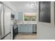 Modern kitchen with stainless steel appliances, bright cabinets and tile backsplash at 1809 Crooked Pine Dr. # G3, Surfside Beach, SC 29575