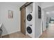 Conveniently located laundry room features a stacked washer and dryer and sliding barn door at 1809 Crooked Pine Dr. # G3, Surfside Beach, SC 29575