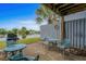 Outdoor patio area offers seating and grill with a picturesque lake view at 1809 Crooked Pine Dr. # G3, Surfside Beach, SC 29575