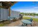 Outdoor patio area offers seating and grill with a picturesque lake view at 1809 Crooked Pine Dr. # G3, Surfside Beach, SC 29575