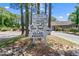 Clubhouse and Villa private property signage with manicured landscaping at 1809 Crooked Pine Dr. # G3, Surfside Beach, SC 29575
