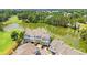 A captivating aerial view of townhomes bordering a scenic lake and lush golf course at 1907 Enclave Ln. # 1907, North Myrtle Beach, SC 29582