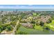 Scenic aerial view of community with golf course, pool, water features, and ocean views at 1907 Enclave Ln. # 1907, North Myrtle Beach, SC 29582