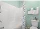 Bathroom with a tub, white fixtures, and simple blue accents at 1907 Enclave Ln. # 1907, North Myrtle Beach, SC 29582