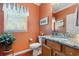 Charming bathroom with granite counters, wood cabinets, and natural light at 1907 Enclave Ln. # 1907, North Myrtle Beach, SC 29582