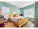 Bright bedroom with hardwood floors, neutral decor, and large windows at 1907 Enclave Ln. # 1907, North Myrtle Beach, SC 29582