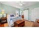 Bedroom with a decorative barn door, plush bed, and colorful decor at 1907 Enclave Ln. # 1907, North Myrtle Beach, SC 29582