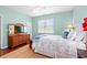 Bright bedroom with a view of the window, television, and stylish decor at 1907 Enclave Ln. # 1907, North Myrtle Beach, SC 29582