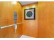 Private elevator with wood paneled walls and ornate framed artwork at 1907 Enclave Ln. # 1907, North Myrtle Beach, SC 29582