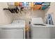 Functional laundry room with washer, dryer and storage shelving at 1907 Enclave Ln. # 1907, North Myrtle Beach, SC 29582