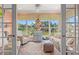 Bright sun room features tranquil pond views and comfortable, stylish furnishings at 1907 Enclave Ln. # 1907, North Myrtle Beach, SC 29582