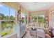 Sun room with large windows, plush seating, and charming decor at 1907 Enclave Ln. # 1907, North Myrtle Beach, SC 29582