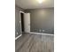 Bedroom with vinyl flooring, neutral paint and open doorway at 2005 Greens Blvd. # D301, Myrtle Beach, SC 29577