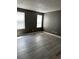 Spacious bedroom with vinyl flooring and two bright windows at 2005 Greens Blvd. # D301, Myrtle Beach, SC 29577