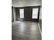 Bedroom with two windows and vinyl flooring at 2005 Greens Blvd. # D301, Myrtle Beach, SC 29577